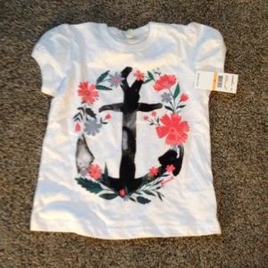 White anchor shirt.